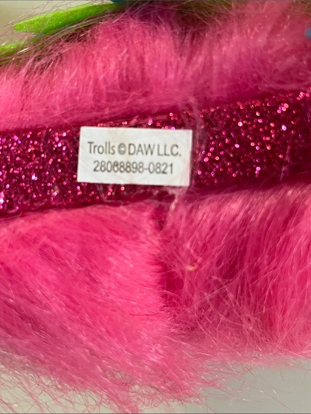 Trolls Bright Pink Faux Fur Headband with Blue and Lime Flowers